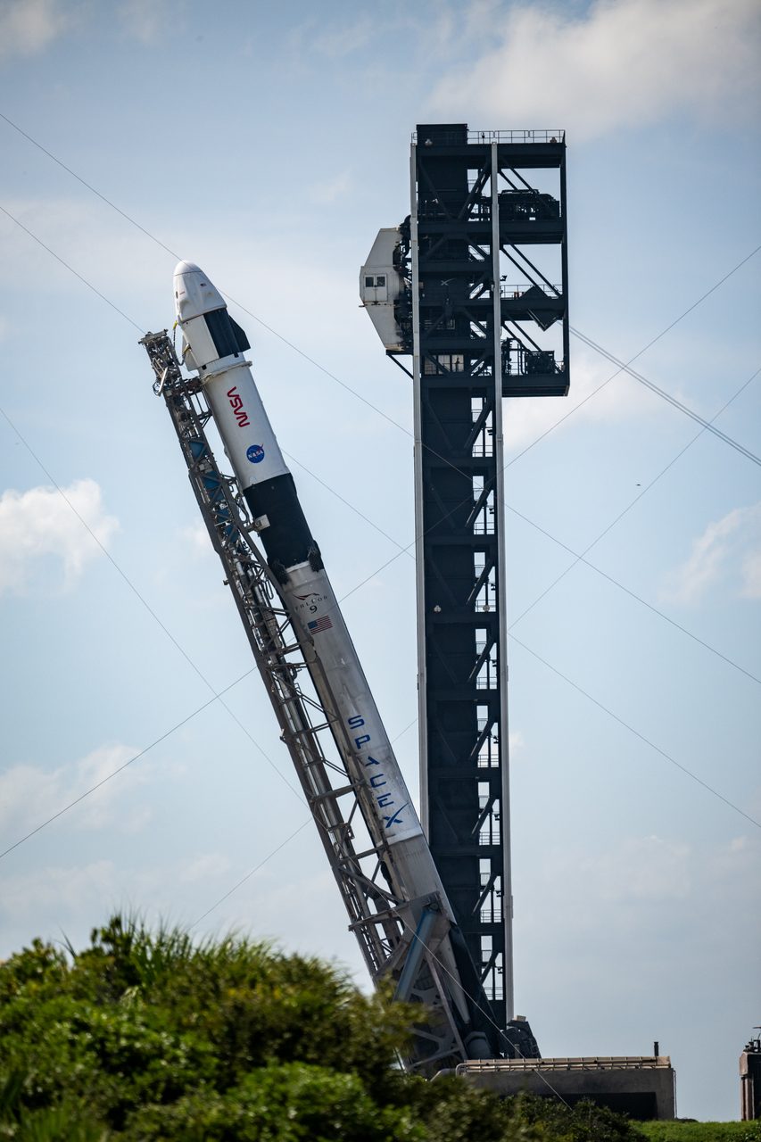 NASA's SpaceX Crew-9 Falcon 9 and Dragon spacecraft rollout at Space Launch Complex, ready for mission launch.