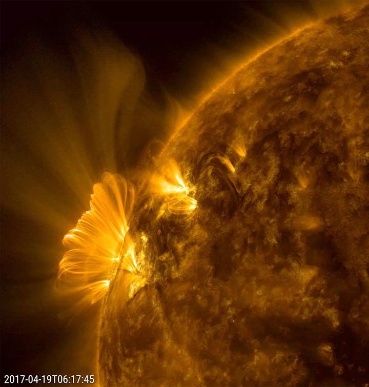 Bright post-coronal loops over the sun's surface, reorganizing magnetic fields after a coronal mass ejection on April 1, 2017.