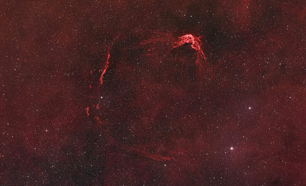 A vibrant image of RCW 86, showcasing the colorful remnants of a historical supernova explosion.