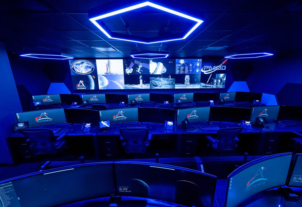 Interior view of twin control rooms at NASA's Marshall Space Flight Center, showcasing advanced technology for Artemis mission monitoring.