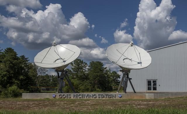 Geostationary Operational Environmental Satellites (GOES) installation process, crucial for weather monitoring and environmental data collection.