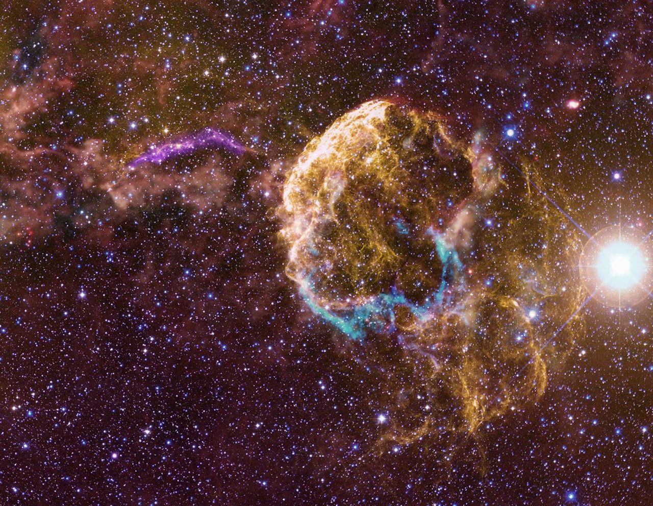 A vibrant cosmic scene showcasing colorful sibling supernova remnants against a dark space background.