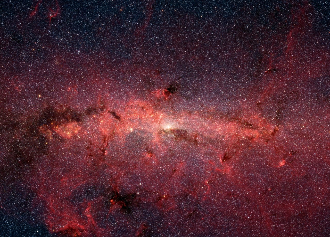 Infrared image of Milky Way galaxy center with dense cluster of stars.
