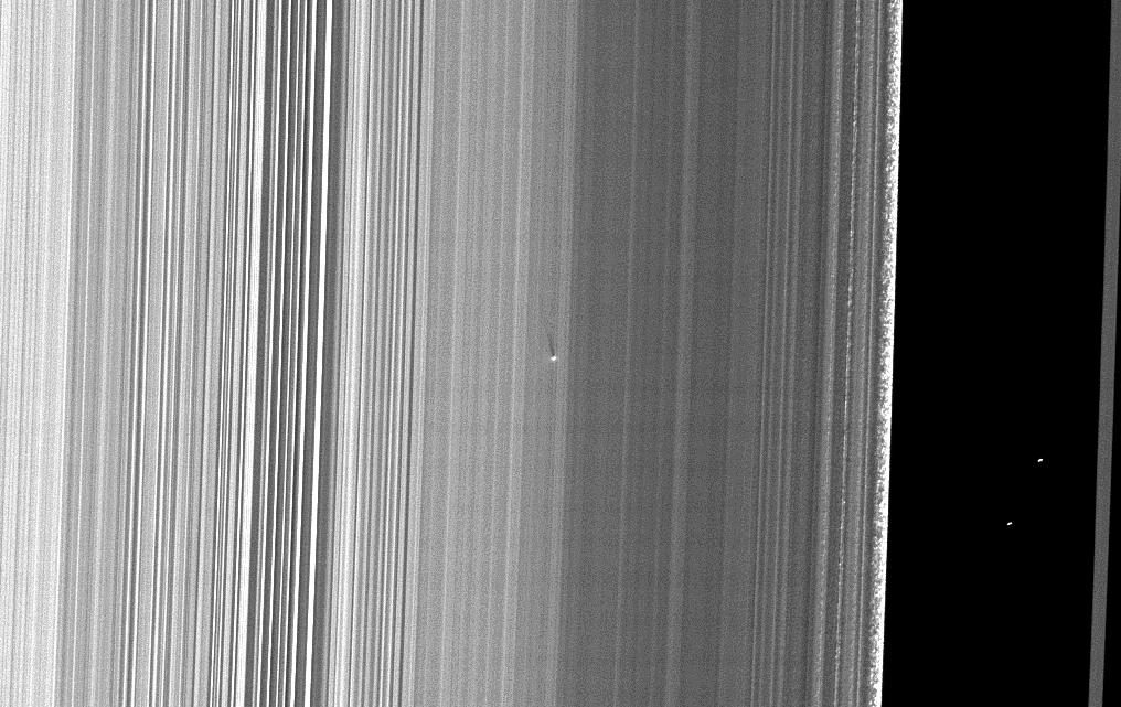 Cassini spacecraft captures shadow of small object on Saturn's B ring during 2009 equinox approach.