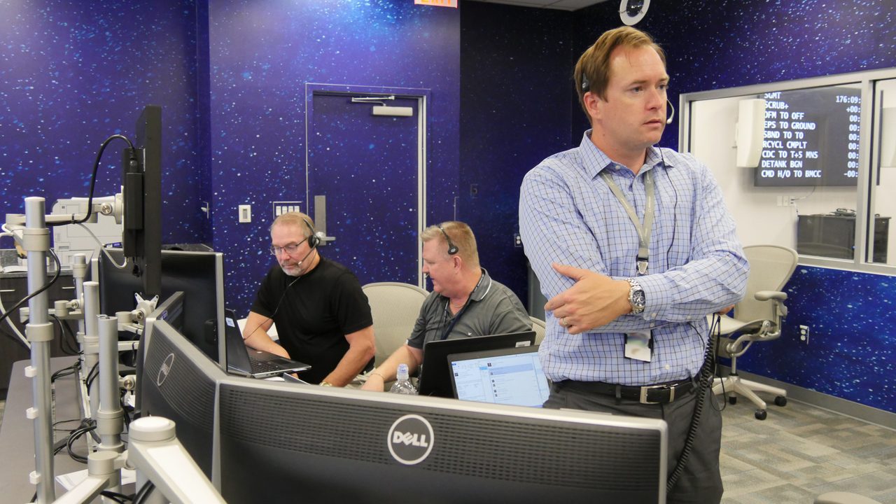 Boeing CST-100 Starliner cockpit simulation with astronauts at Kennedy Space Center