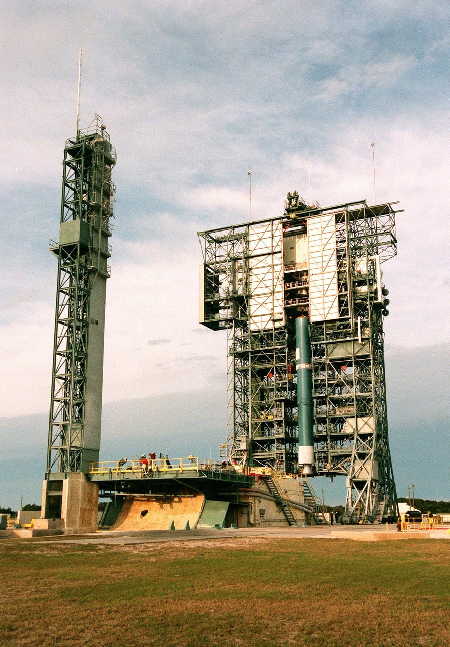 Aerial view of Kennedy Space Center with launch pads and surrounding landscape.