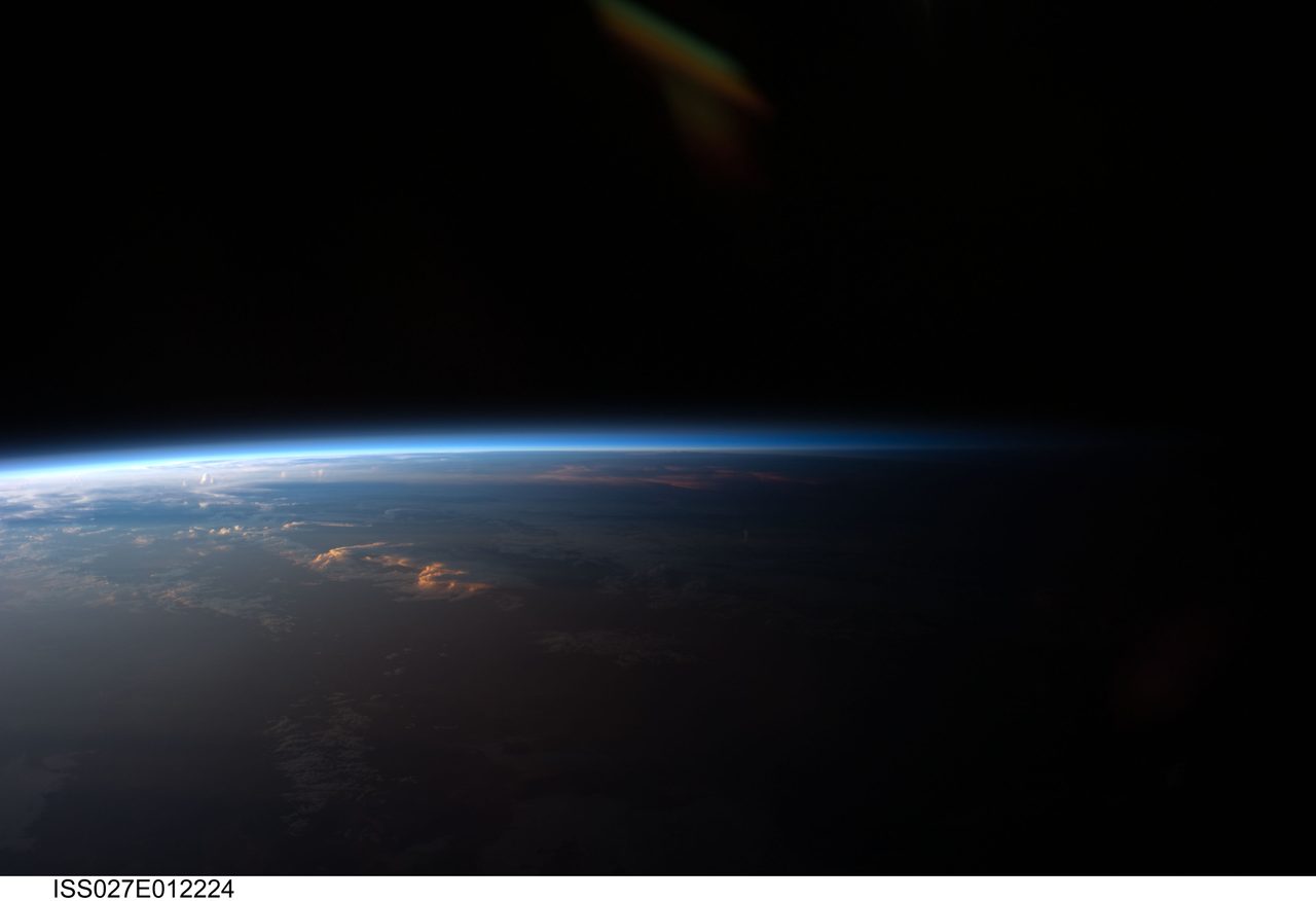 Aerial view of Earth's diverse landscapes and cloud formations captured by Expedition 27 crew from space.