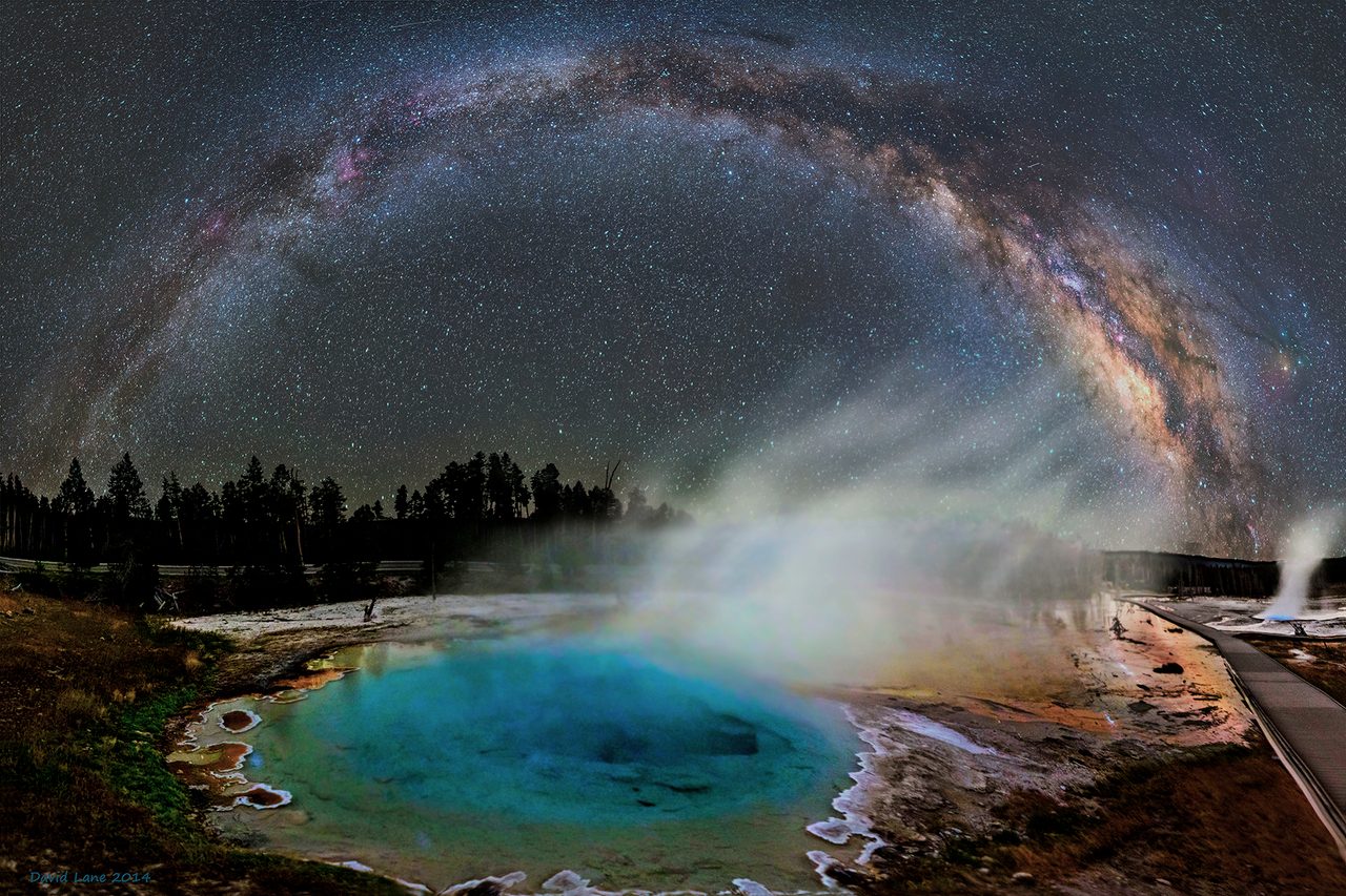 A breathtaking view of the Milky Way galaxy illuminating the night sky over Yellowstone National Park.