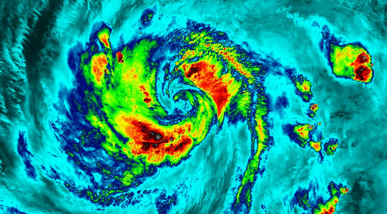 Satellite image showing swirling clouds and vibrant colors of Hurricane Blanca over the ocean.