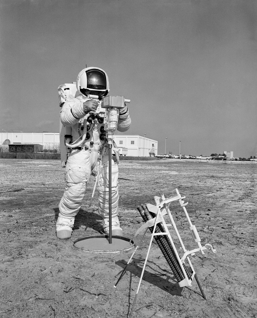 Apollo 13 astronauts conduct detailed walk-through of extravehicular activity timeline at Kennedy Space Center.