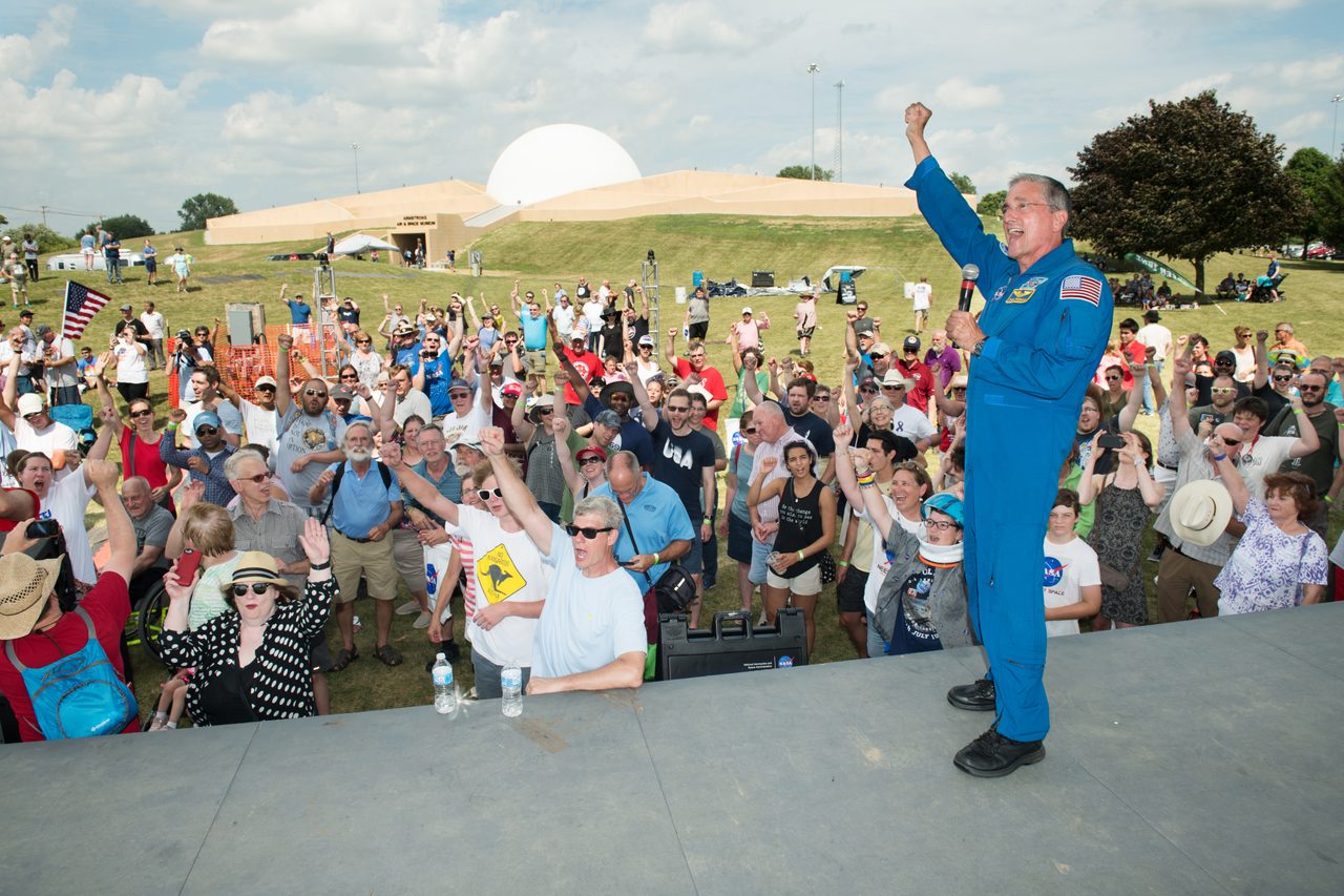 Crowds gather at Summer Moon Festival in Wapakoneta, Ohio, celebrating Apollo 11 moon landing.