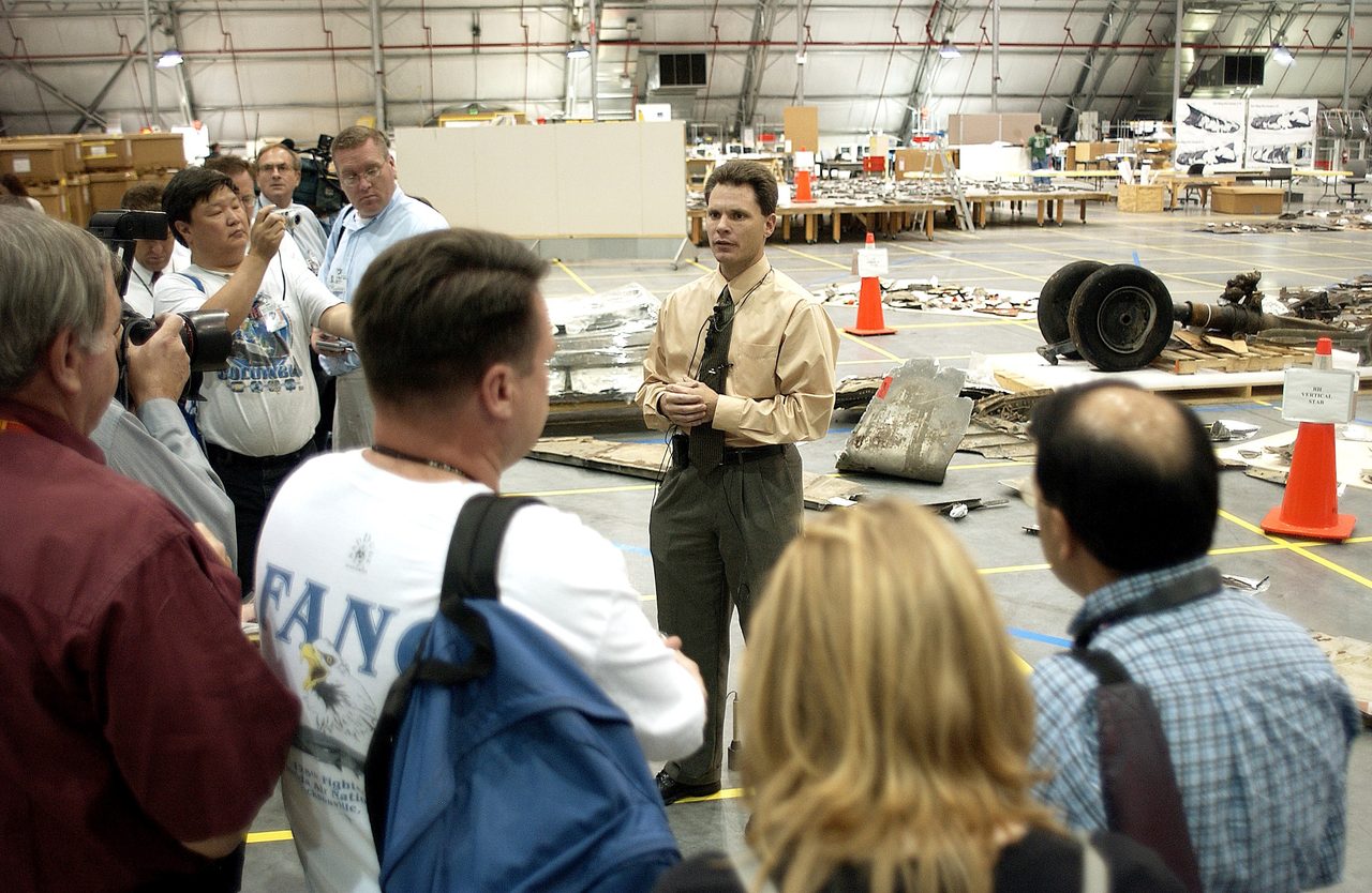 Scott Thurston discusses Columbia debris packing efforts in the hangar, with over 83,000 pieces recovered from East Texas.
