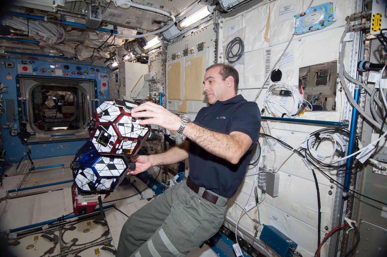 Astronaut Mastracchio conducting the SPHERES Vertigo Experiment inside the International Space Station.