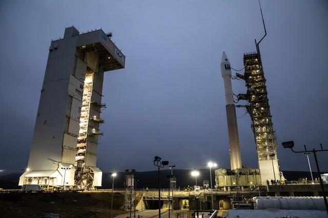 Landsat 9 satellite being rolled out at Space Launch Complex 3 under clear skies.