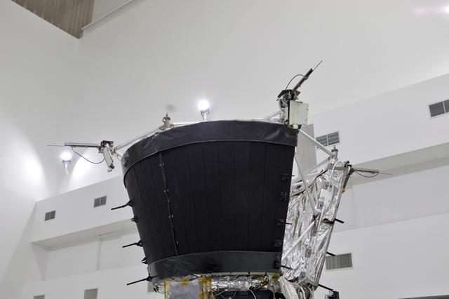 The Parker Solar Probe's antenna fully deployed against a backdrop of deep space, showcasing its intricate design and engineering.