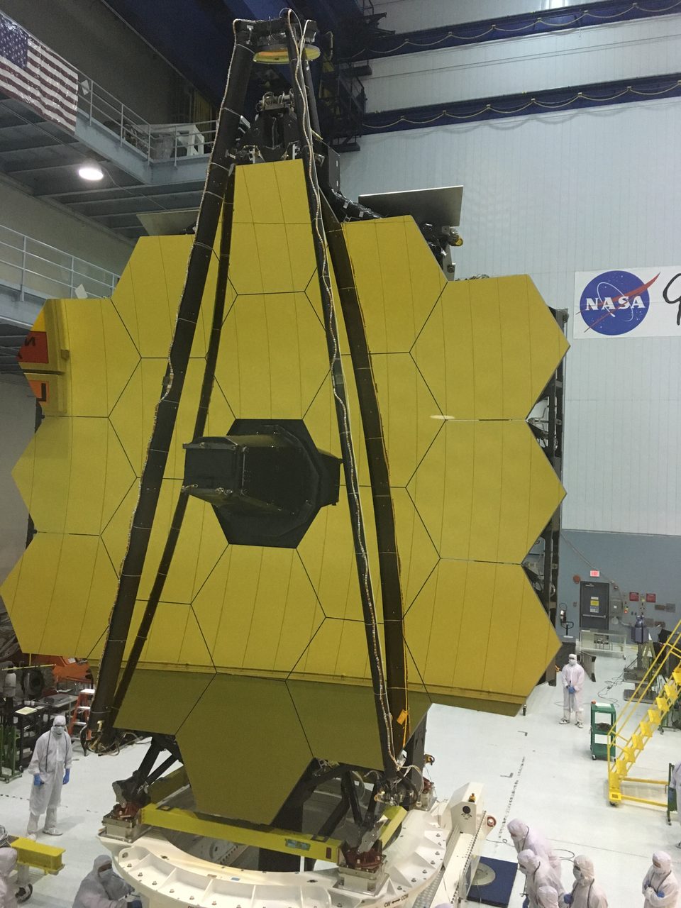 The James Webb Space Telescope displayed against a starry backdrop, showcasing its golden hexagonal mirrors.