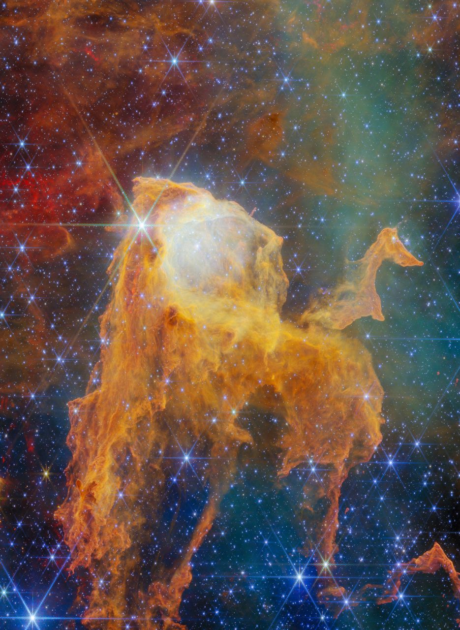 A vibrant image of the Carina Nebula showcasing colorful cosmic clouds and bright stars in deep space.