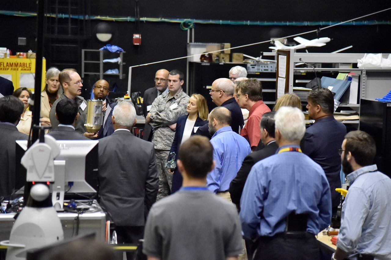 Science and Technology Partnership Forum members watching a presentation on satellite servicing and in-space assembly.