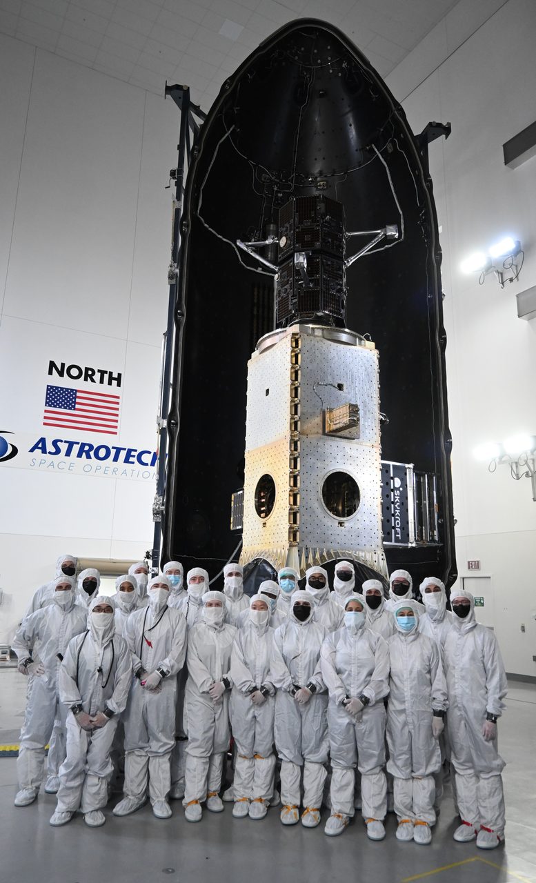 SpaceX TRACERS satellite being encapsulated in payload fairing at launch facility.
