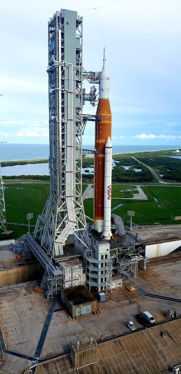 NASA's Artemis I Space Launch System illuminated at night on Launch Complex 39B, ready for mission.