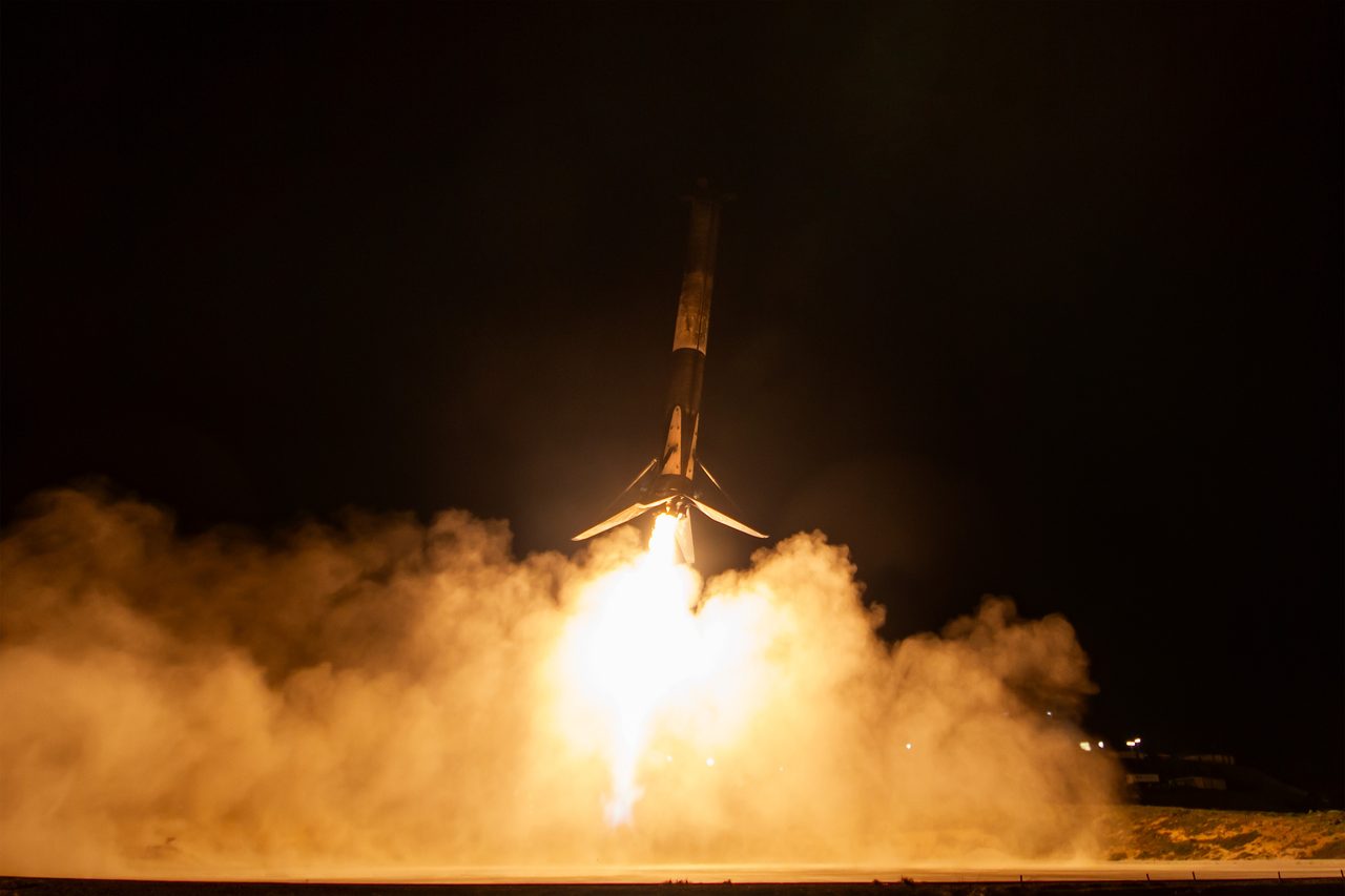 NASA's Pandora satellite launching into space aboard a SpaceX rocket under a clear blue sky.