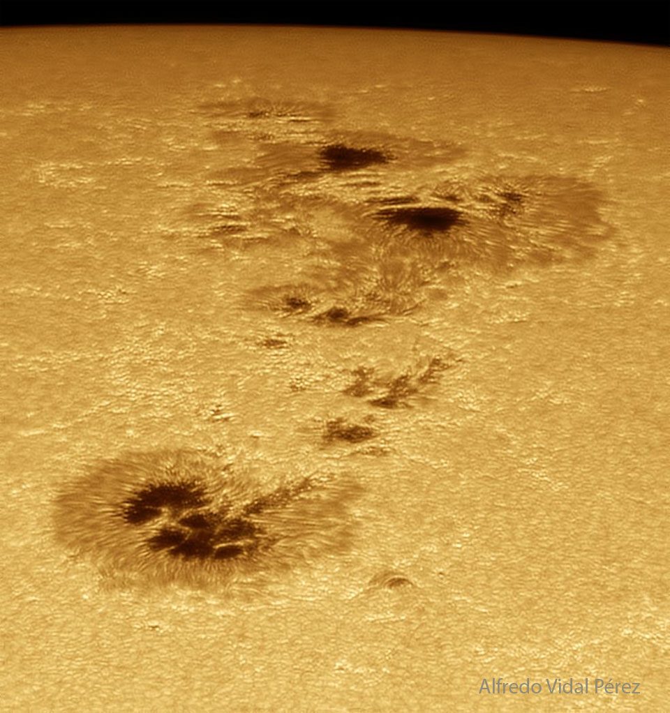 Close-up of AR 4478 sunspot group on the sun's surface, showcasing dark spots and solar activity.