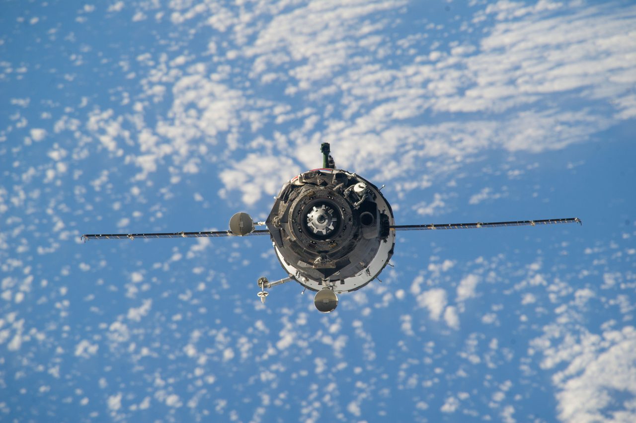 Soyuz TMA-12M spacecraft approaching the International Space Station against a backdrop of space.