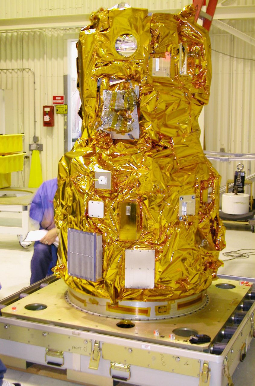 Wide shot of a spacecraft assembly area at Kennedy Space Center, marked KSC-04pd1594.