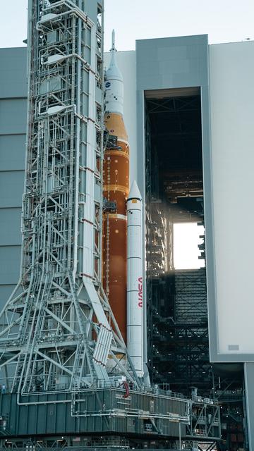 Space Launch System rocket and Orion Spacecraft being transported at Kennedy Space Center.