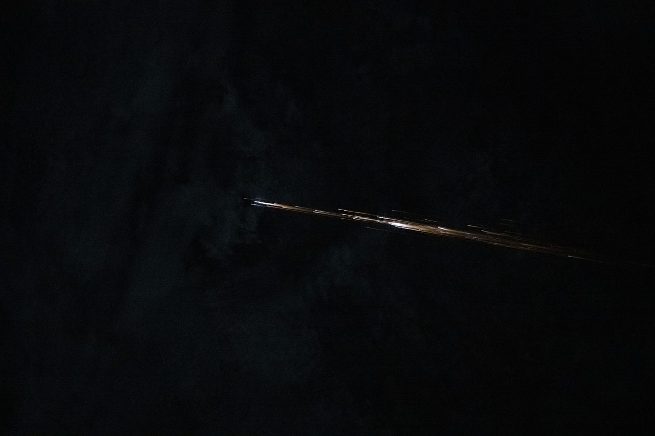 Unidentified space debris floats near the International Space Station, visible against the dark expanse of space.