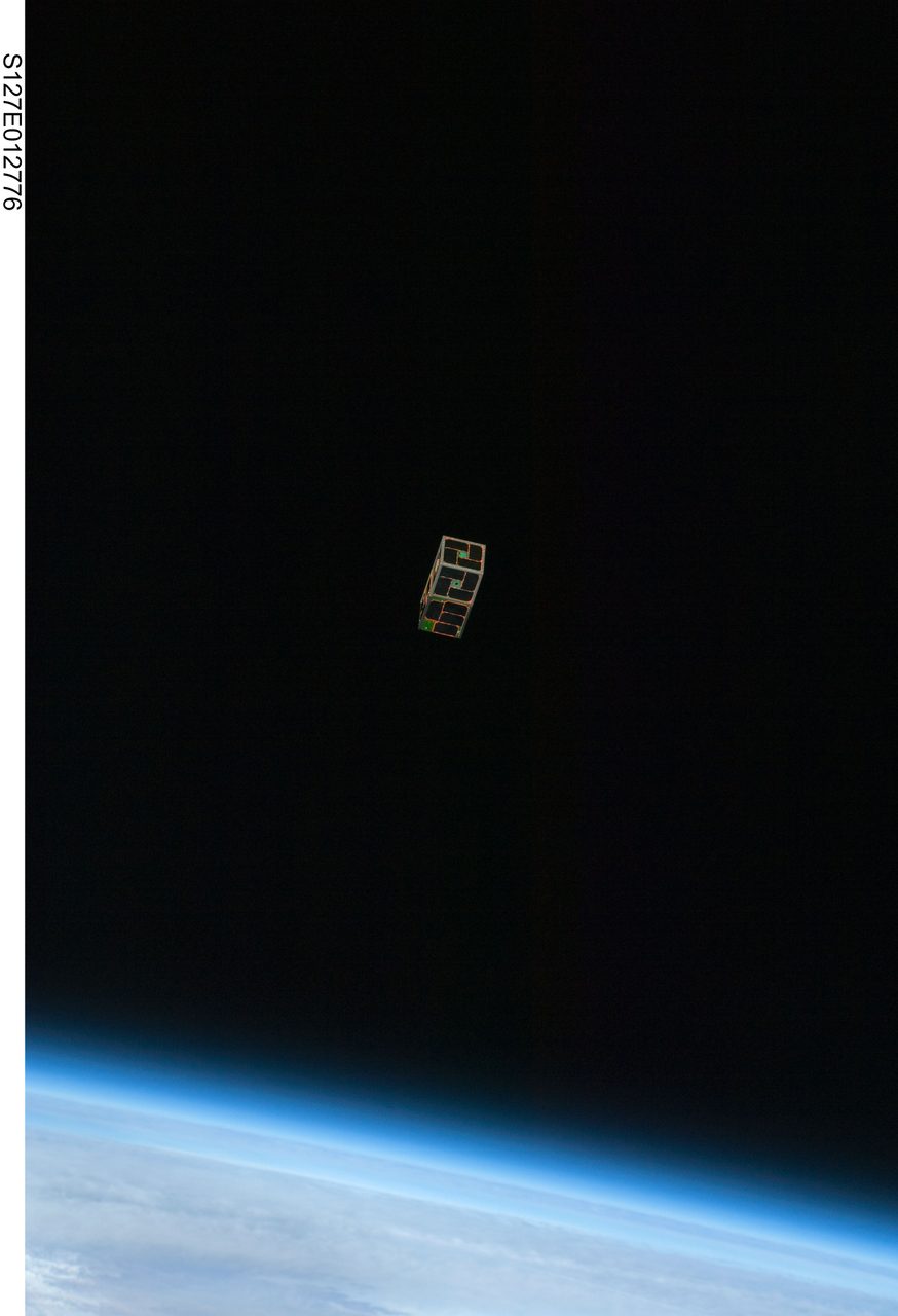 View of Earth from space with clouds and landmasses, captured by STS-127 crew