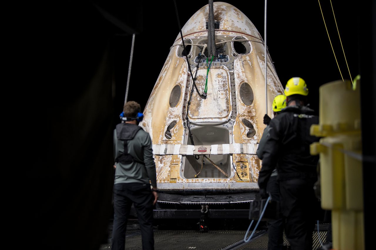 SpaceX Crew-2 capsule splashing down safely in ocean after successful mission.