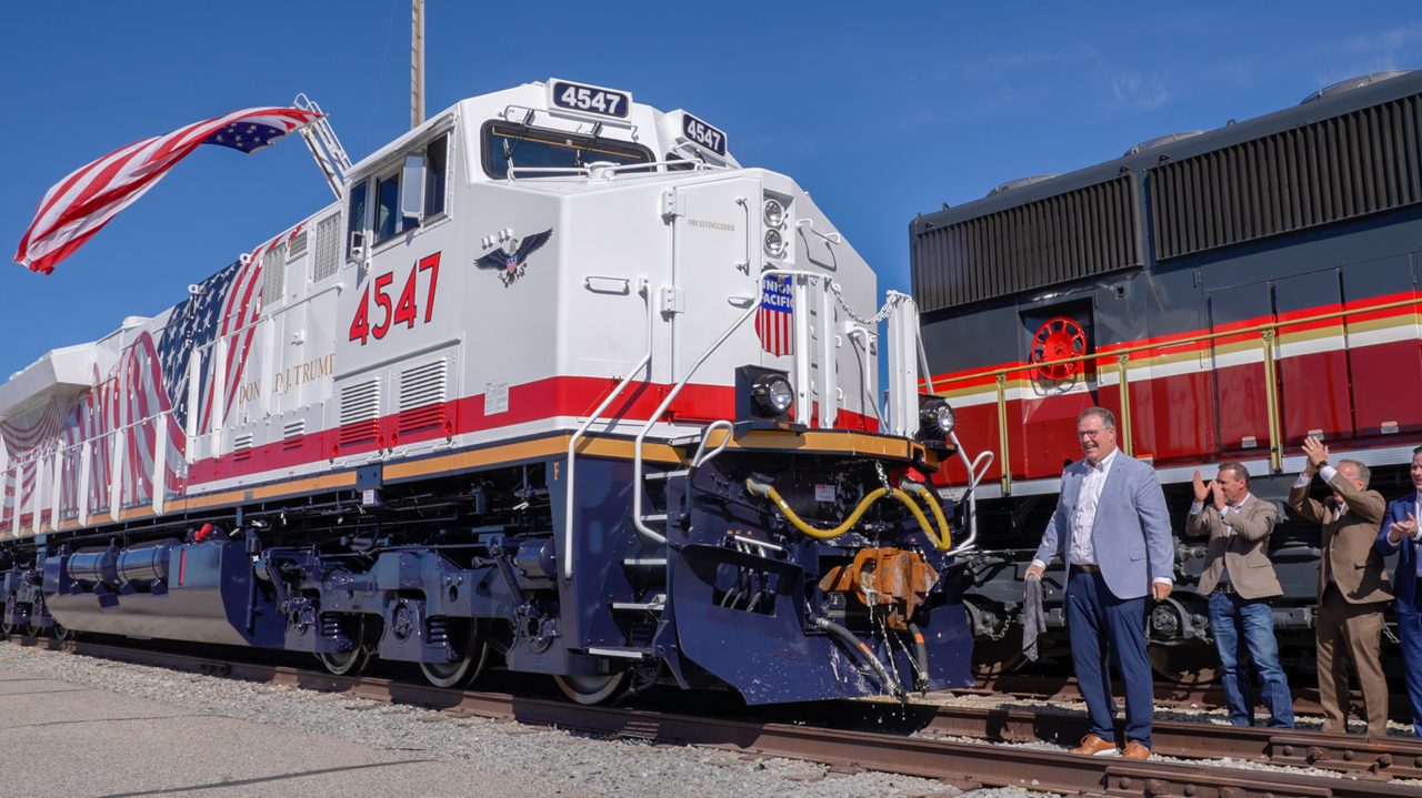 Specialized rail carriers transport Artemis III booster segments to Kennedy Space Center for NASA's SLS rocket assembly.