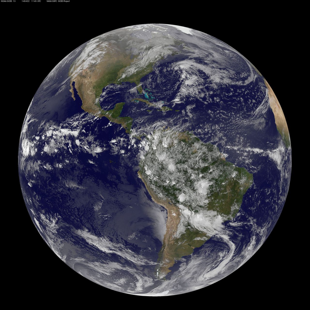 Satellite image showing North and South America with cloud patterns on Earth Day.