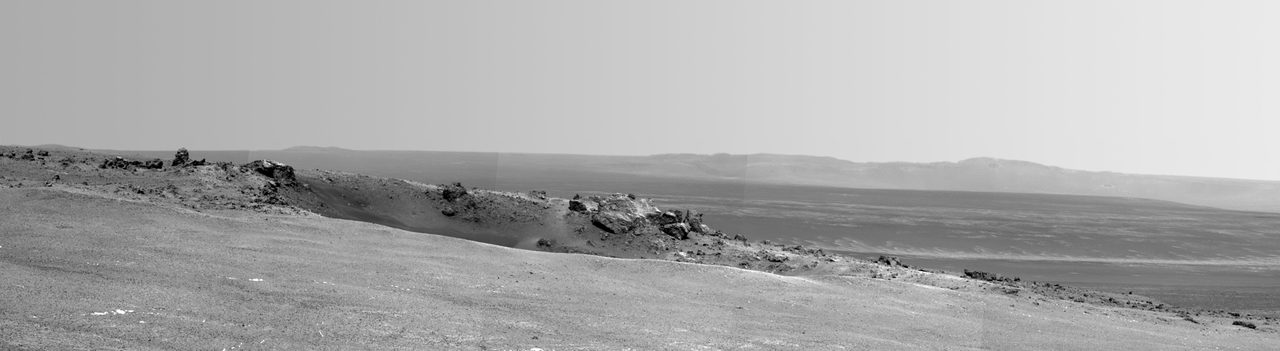 NASA's Mars Rover Opportunity captures Spirit Point area, showing a small crater and Endeavour's interior on the rim.