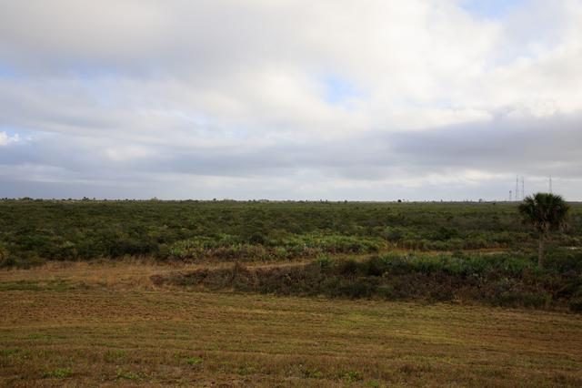 Aerial view of Launch Complex 49 with surrounding landscape and infrastructure.