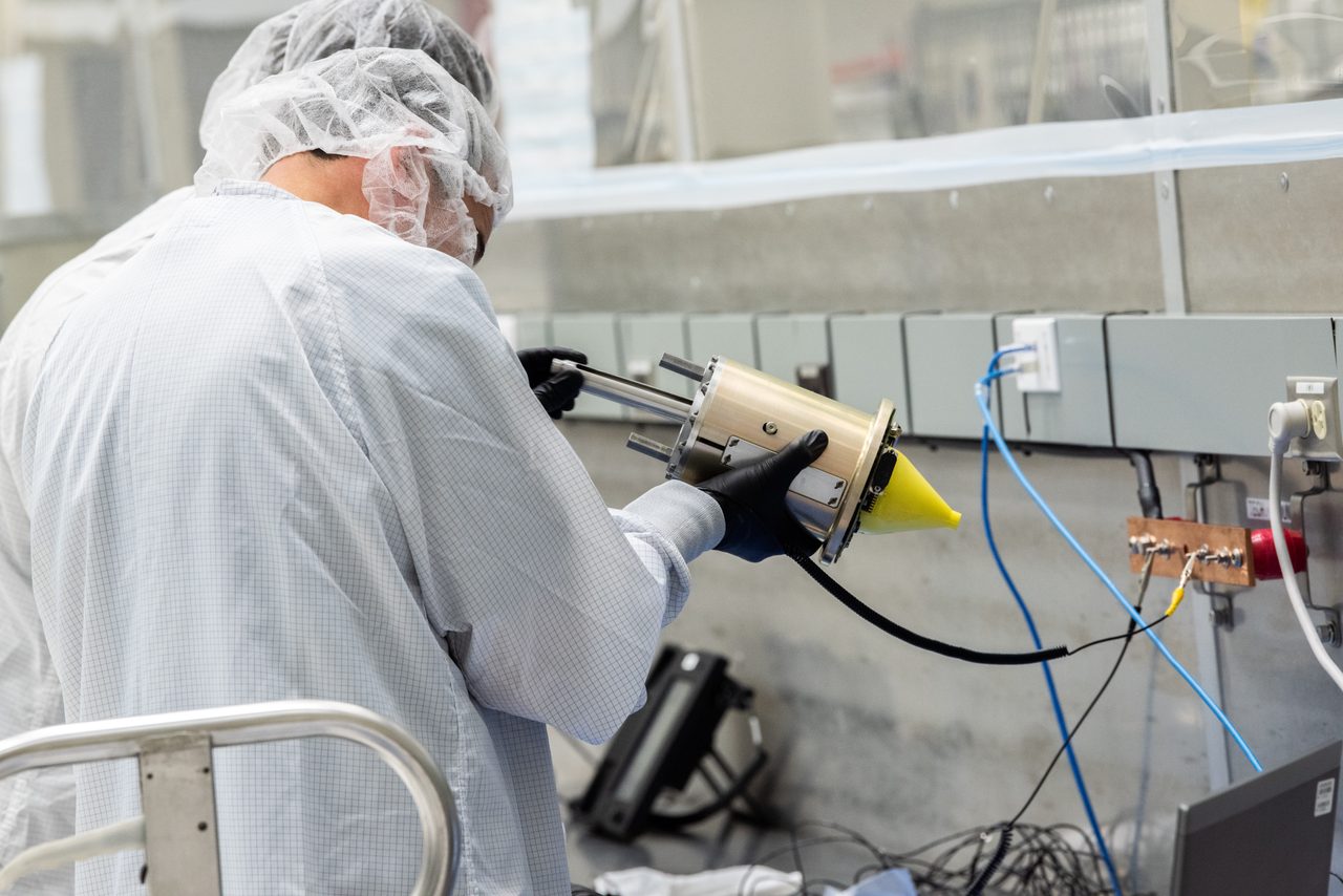 Technicians installing EDR on LOFTID spacecraft in a cleanroom environment.