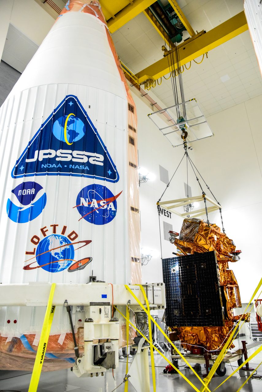 JPSS-2 spacecraft being moved to integration and testing cart, unbagged, and placed on Aronson Table.