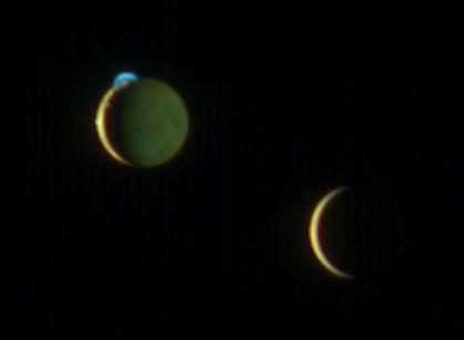 Artistic depiction of two moons orbiting the gas giant planet Jupiter against a starry background.