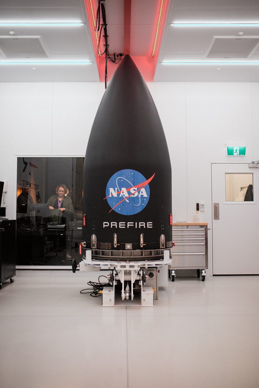 Technicians work on Rocket Lab PREFIRE satellite integration in a clean room environment.