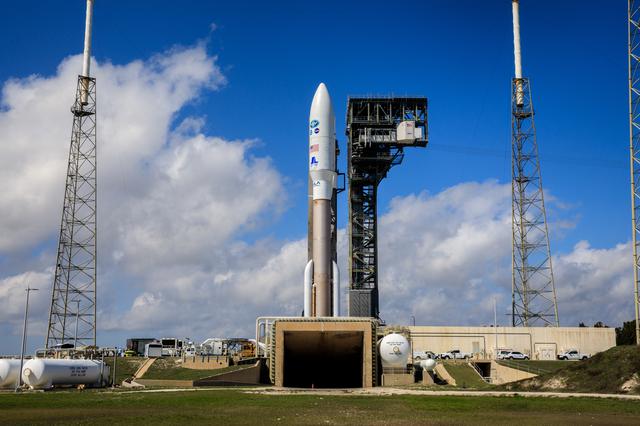 GOES-T satellite being transported to launch pad SLC-41 under clear blue skies at Cape Canaveral.