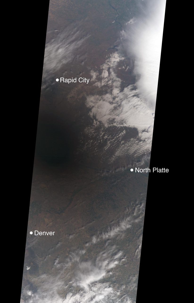 Satellite image showing the moon's shadow moving across eastern Wyoming and western Nebraska during the eclipse.