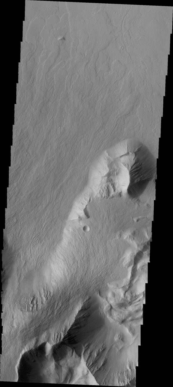 NASA Mars Odyssey image of Olympus Rupes, a steep cliff-face surrounding Olympus Mons, highlighting volcanic and lava flow features.