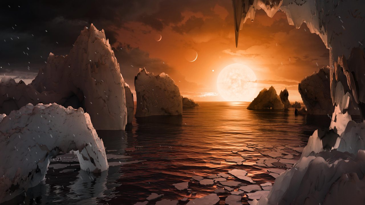 Artist's concept of a rocky landscape on exoplanet TRAPPIST-1f under a starry sky.