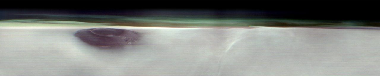 Aerial view of Arsia Mons volcano on Mars, captured pre-dawn by NASA's Mars Odyssey orbiter, showing atmospheric study conditions.