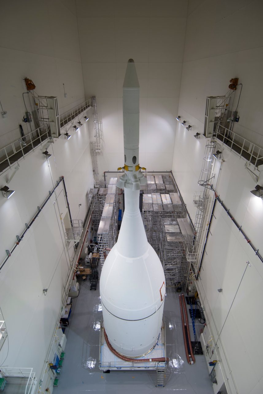 Fully assembled Orion spacecraft on launch pad, ready for its upcoming mission to space.