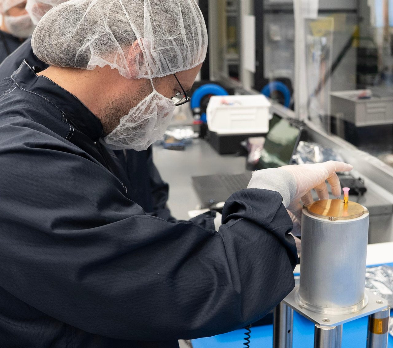 NASA engineer adjusts telecommunications payload at Firefly Aerospace facility in Cedar Park, Texas.