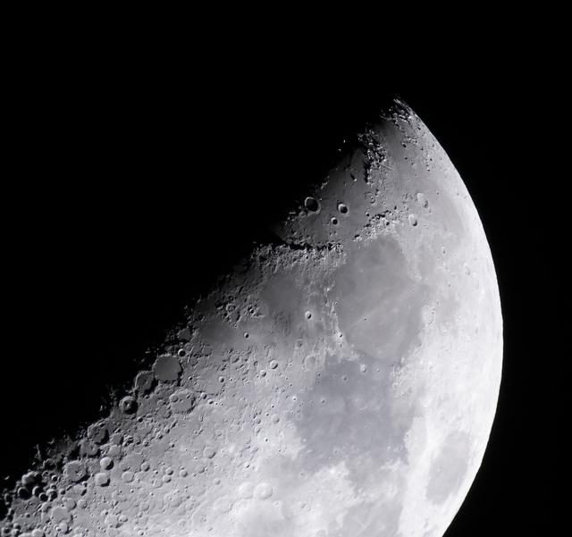 Aerial view of Apollo 15 landing site in Hadley-Apennine region, showcasing lunar terrain features.