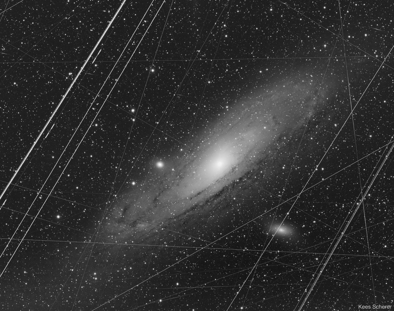 A detailed view of the Andromeda galaxy showing its natural colors and intricate spiral structure.