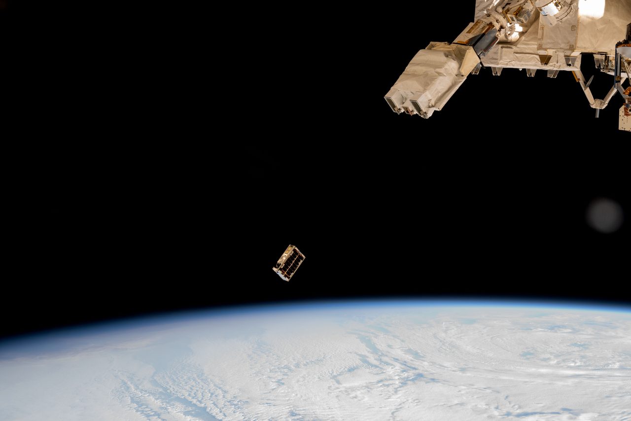 CubeSat being released into Earth's orbit from a deployer